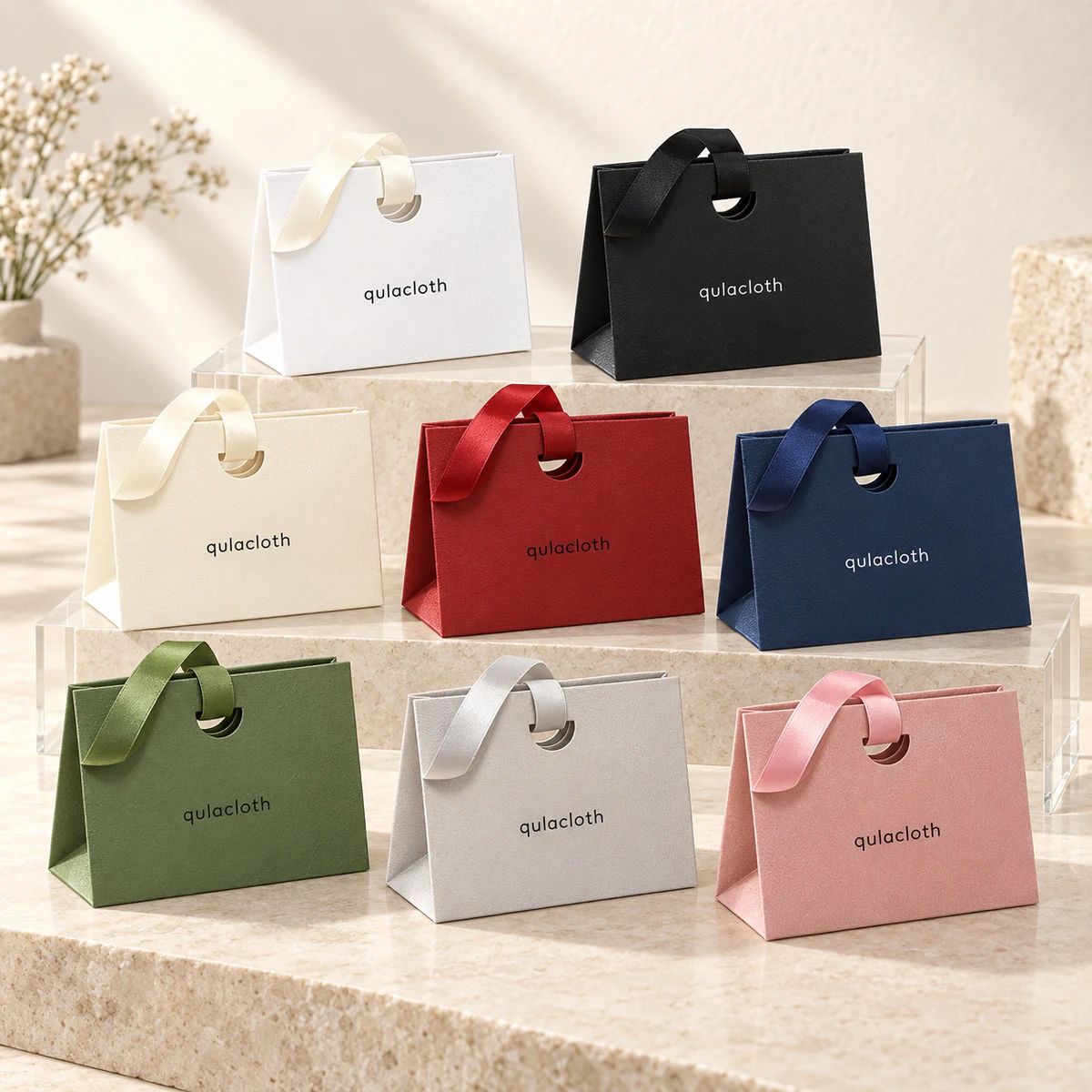 Eight custom color paper gift bags for jewelry brands in white ivory black green red navy gray and pink