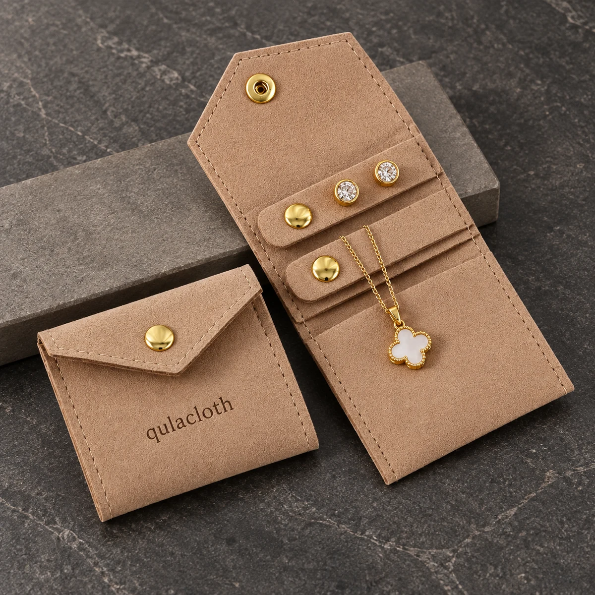 Custom logo microfiber jewelry pouch shown folded to 6 x 5.5 cm and unfolded with jewelry