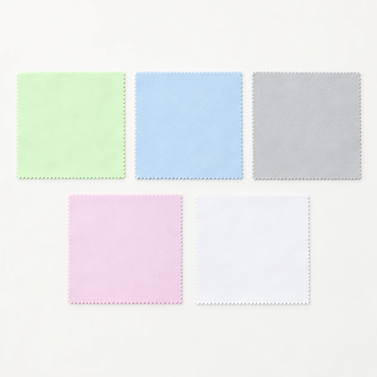 Five square 15 x 15 cm jewelry cleaning cloth color options arranged on a white background