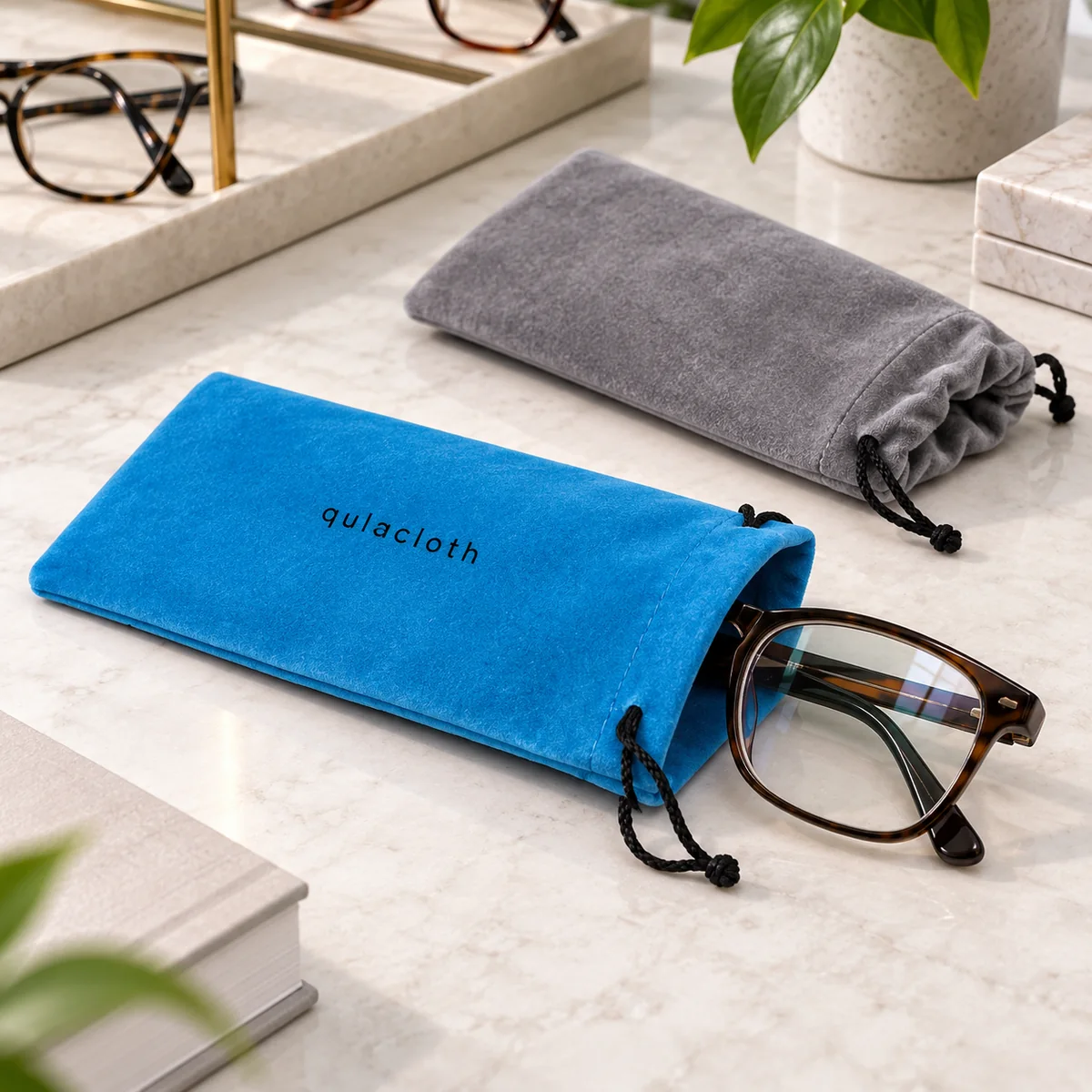 Blue flocked drawstring eyeglass pouch with optical frames for wholesale eyewear packaging