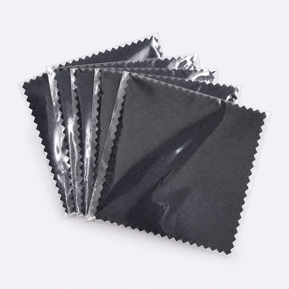 Two black silver polishing cloths individually packaged in clear sleeves