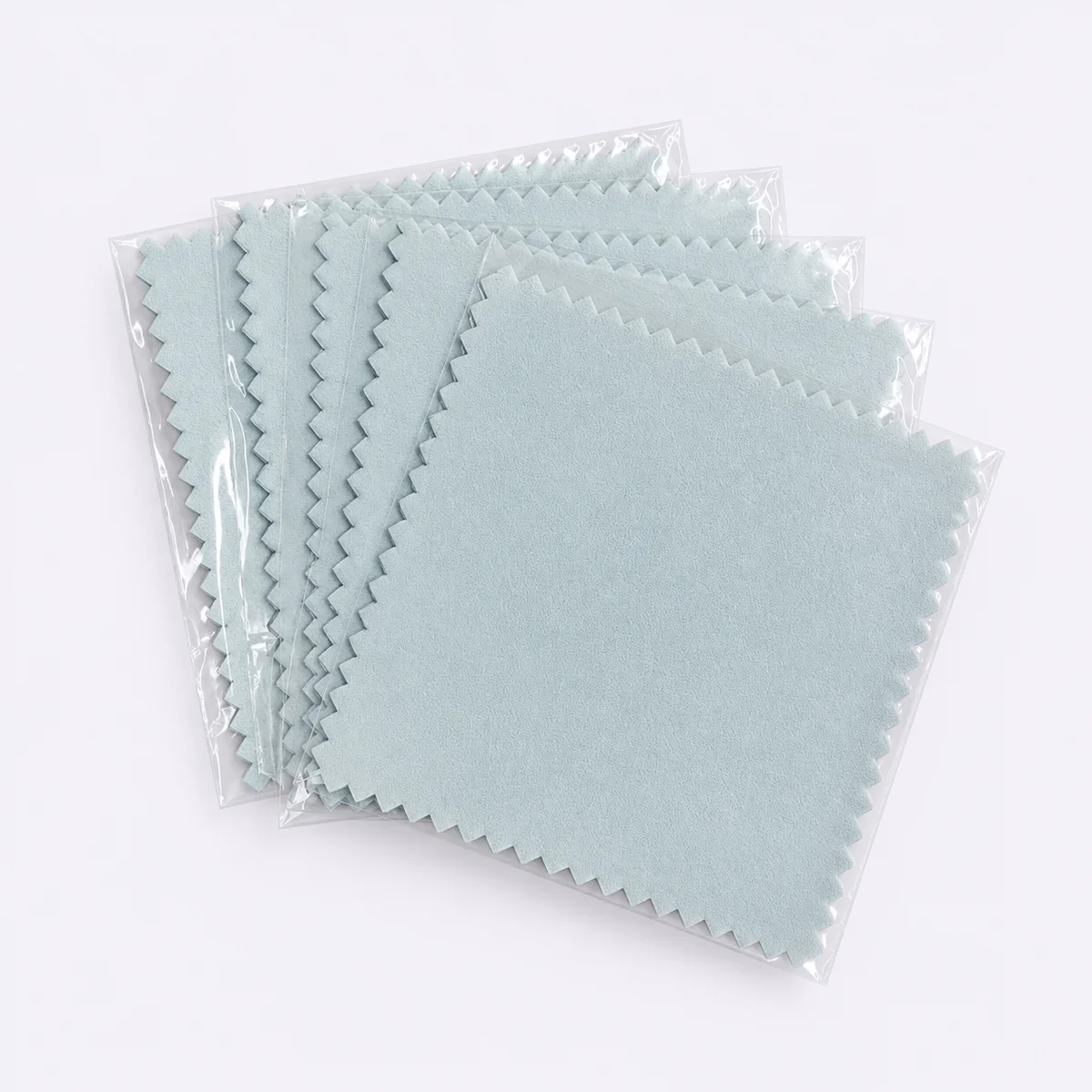 Two light blue silver polishing cloths in separate clear sleeves