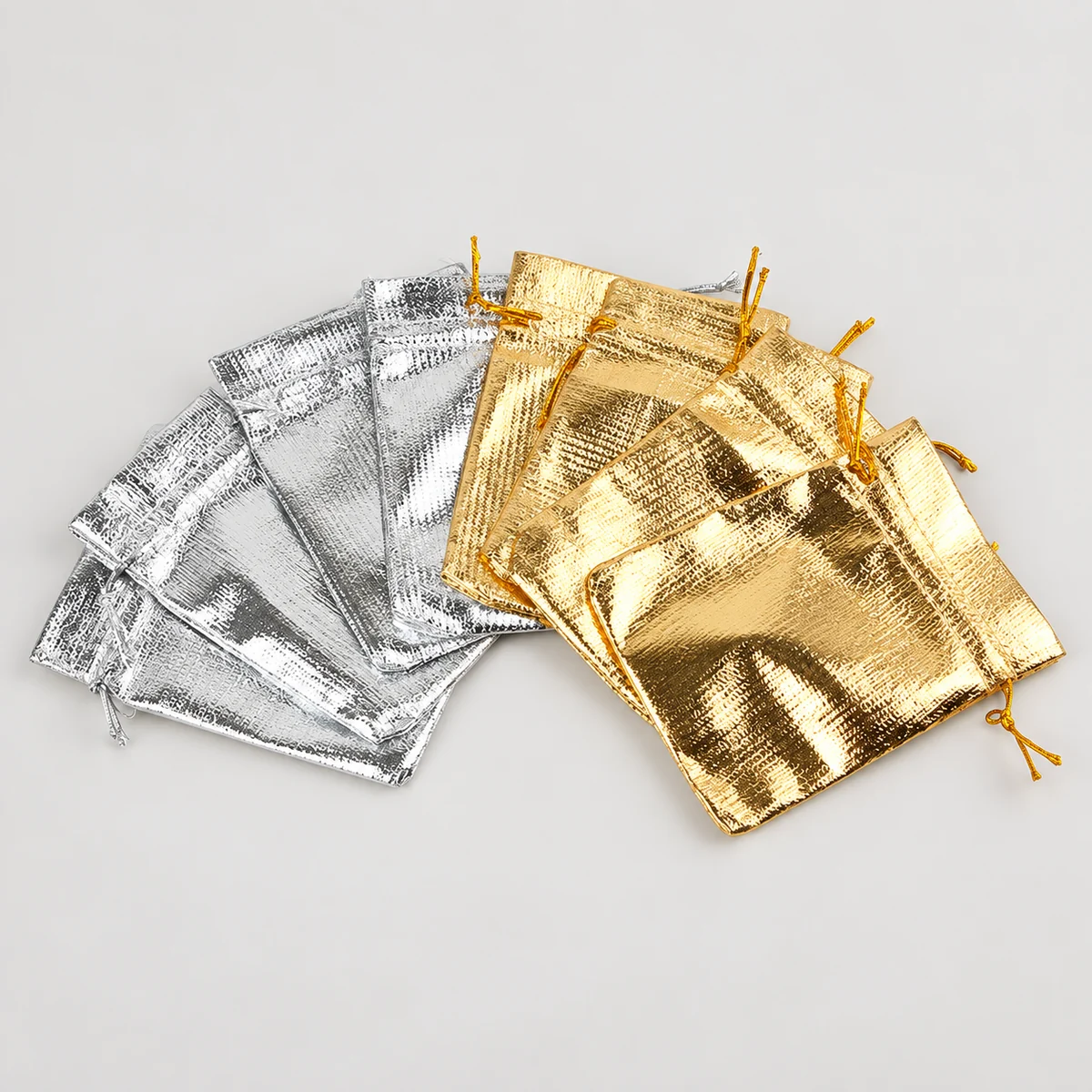 Wholesale assortment of gold and silver metallic drawstring jewelry pouches